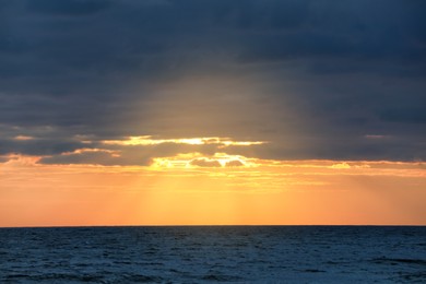 Picturesque view of beautiful sky with clouds over sea at sunset Photo of Picturesque view of beautiful sky with clouds over sea at sunset