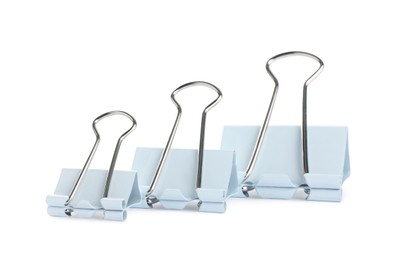 Different binder clips on white background. Stationery item Photo of Different binder clips on white background. Stationery item
