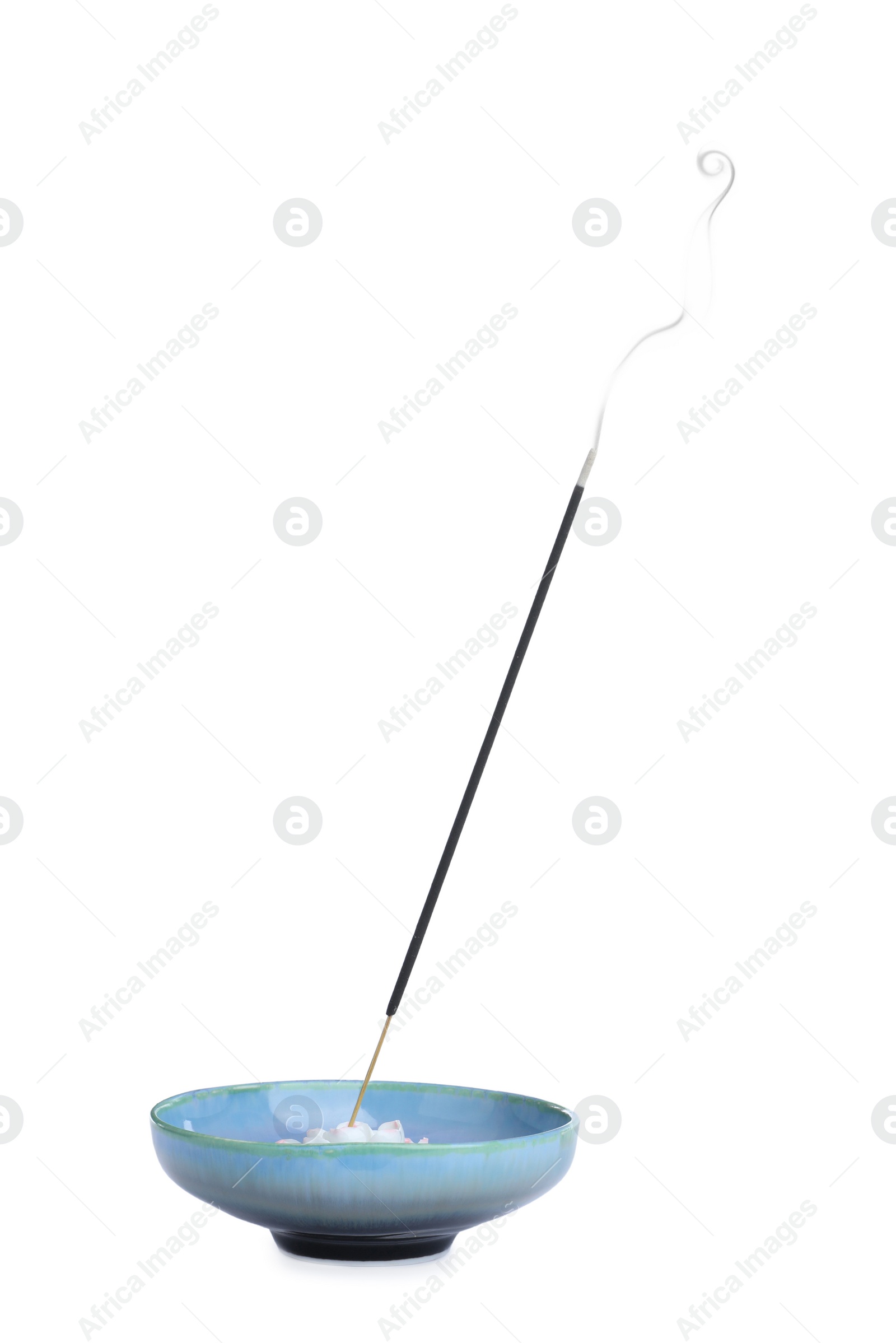 Incense stick smoldering in holder on white background Photo of Incense stick smoldering in holder on white background