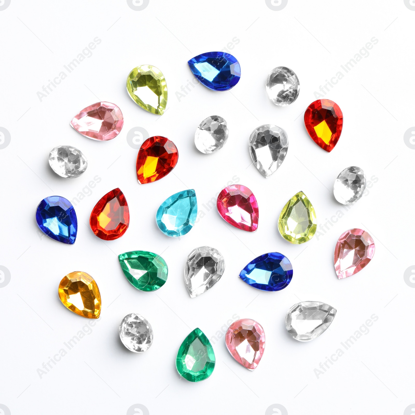 Different beautiful gemstones on white background, top view Image of Different beautiful gemstones on white background, top view