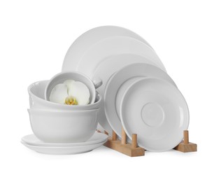 Set of dishware and flower on white background Photo of Set of dishware and flower on white background