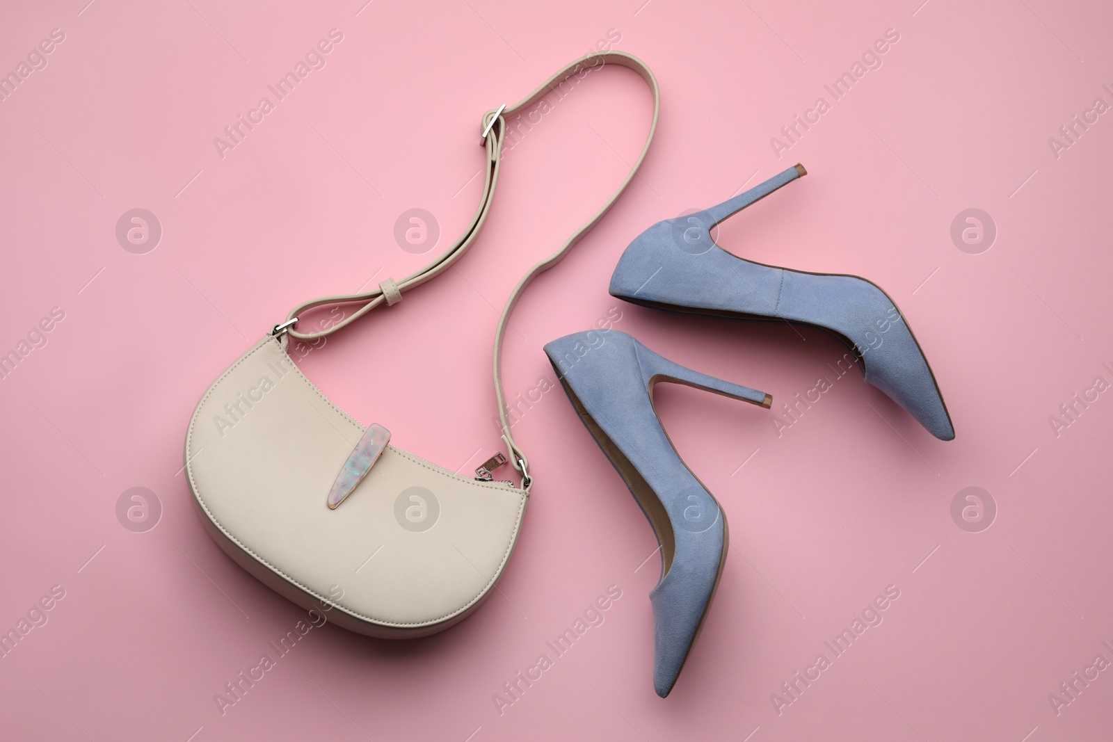 Stylish woman's bag and shoes on pink background, flat lay Photo of Stylish woman's bag and shoes on pink background, flat lay