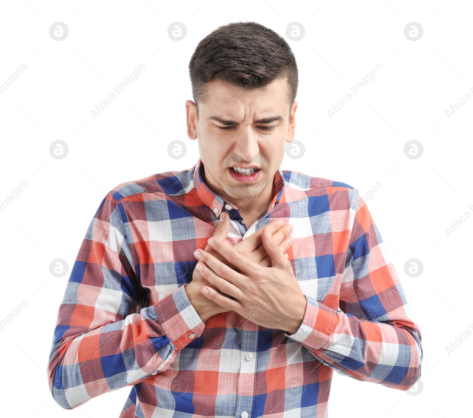 Young man suffering from chest pain on white background Photo of Young man suffering from chest pain on white background