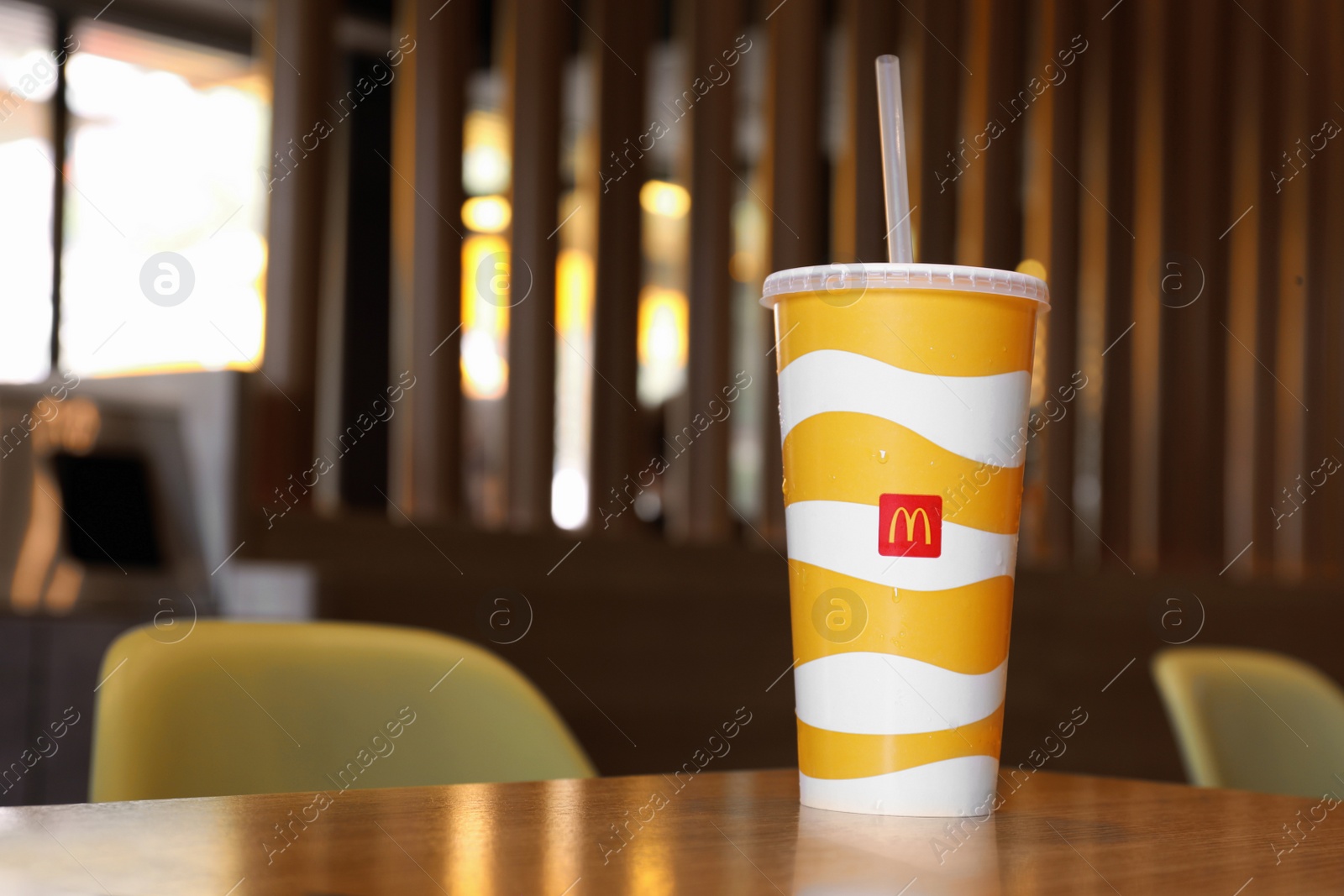 MYKOLAIV, UKRAINE - AUGUST 11, 2021: Cold McDonald's drink on table in cafe. Space for text Photo of MYKOLAIV, UKRAINE - AUGUST 11, 2021: Cold McDonald's drink on table in cafe. Space for text