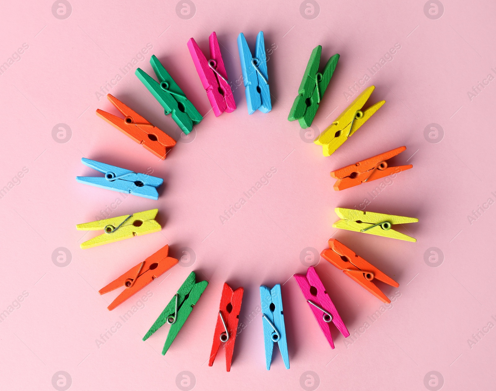 Frame of many different colorful clothes pins on pink background, flat lay. Diversity concept Photo of Frame of many different colorful clothes pins on pink background, flat lay. Diversity concept