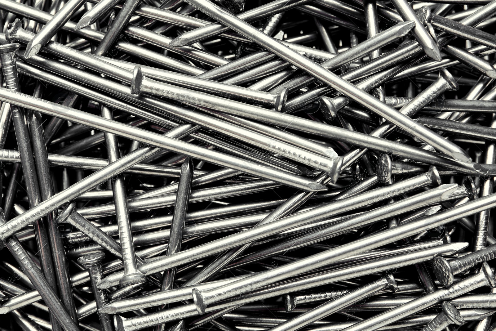 Pile of metal nails as background, closeup Photo of Pile of metal nails as background, closeup