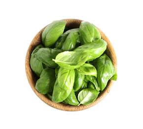Fresh green basil leaves in wooden bowl isolated on white, top view Photo of Fresh green basil leaves in wooden bowl isolated on white, top view