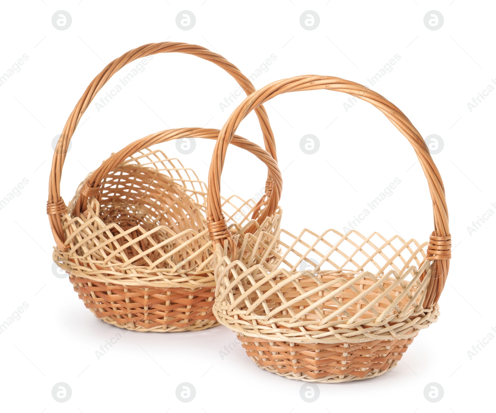 Three decorative wicker baskets on white background Photo of Three decorative wicker baskets on white background