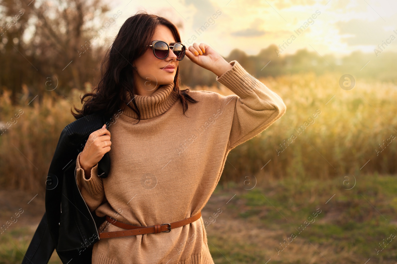Beautiful young woman wearing stylish autumn clothes outdoors Photo of Beautiful young woman wearing stylish autumn clothes outdoors