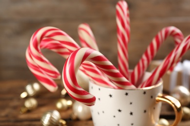 Sweet Christmas candy canes in cup, closeup Photo of Sweet Christmas candy canes in cup, closeup