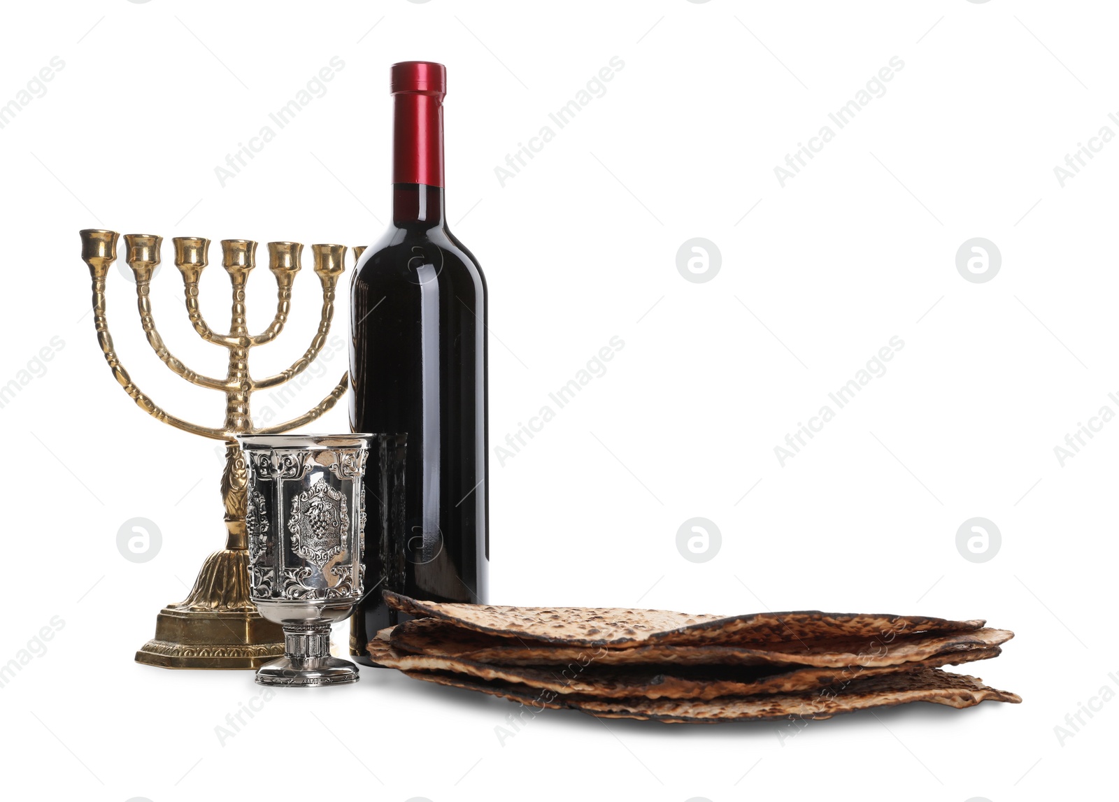 Tasty matzos, wine and menorah on white background. Passover (Pesach) celebration Photo of Tasty matzos, wine and menorah on white background. Passover (Pesach) celebration