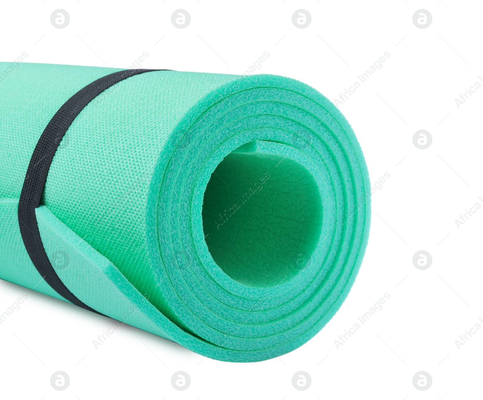 Rolled camping mat on white background, closeup Photo of Rolled camping mat on white background, closeup