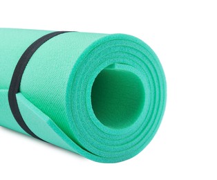 Rolled camping mat on white background, closeup Photo of Rolled camping mat on white background, closeup