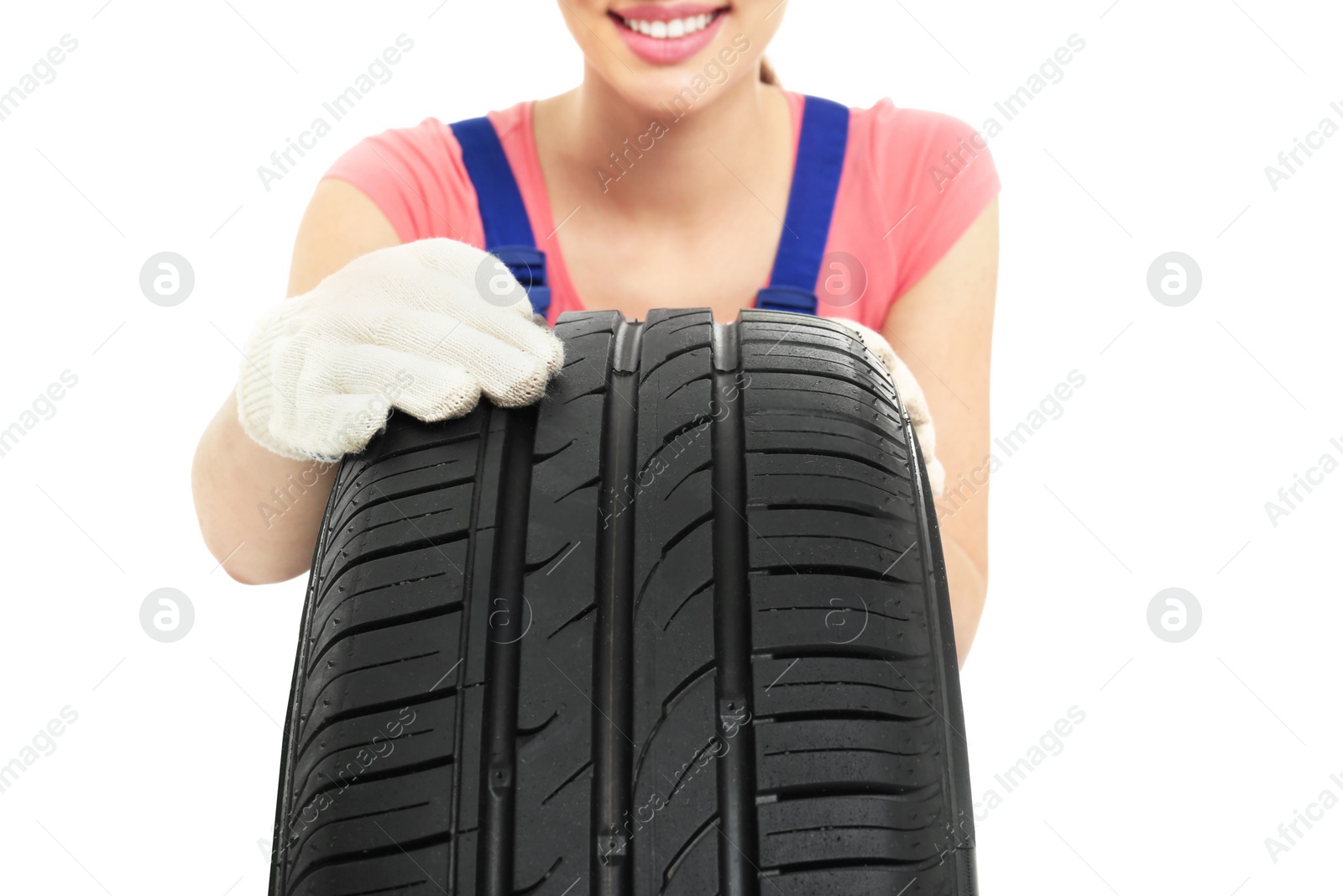 Female mechanic with car tire on white background, closeup Photo of Female mechanic with car tire on white background, closeup
