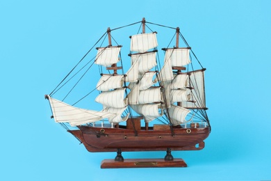 Beautiful ship model on light blue background Photo of Beautiful ship model on light blue background