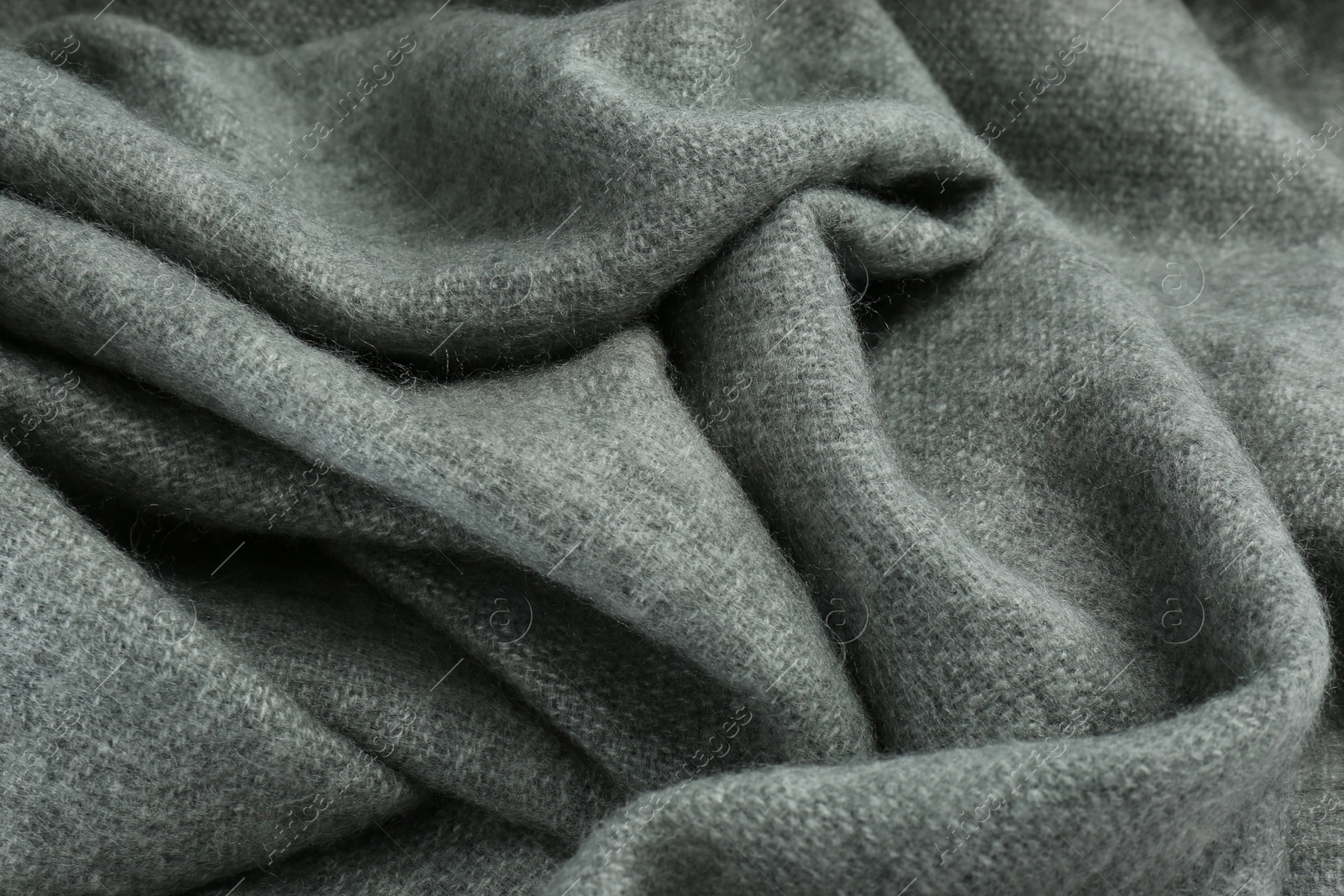 Stylish grey cashmere scarf as background, closeup Photo of Stylish grey cashmere scarf as background, closeup