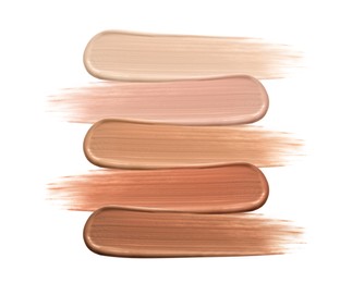 Different shades of liquid skin foundation on white background, top view Image of Different shades of liquid skin foundation on white background, top view