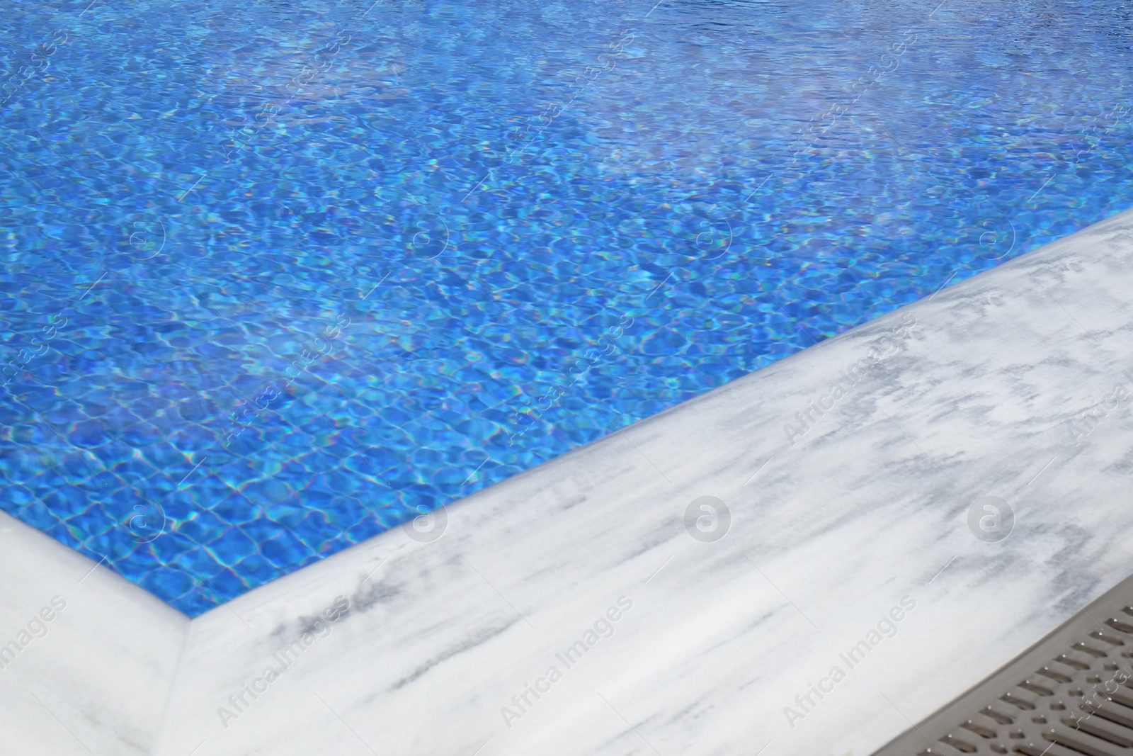 Photo of Outdoor swimming pool with clear water on sunny day