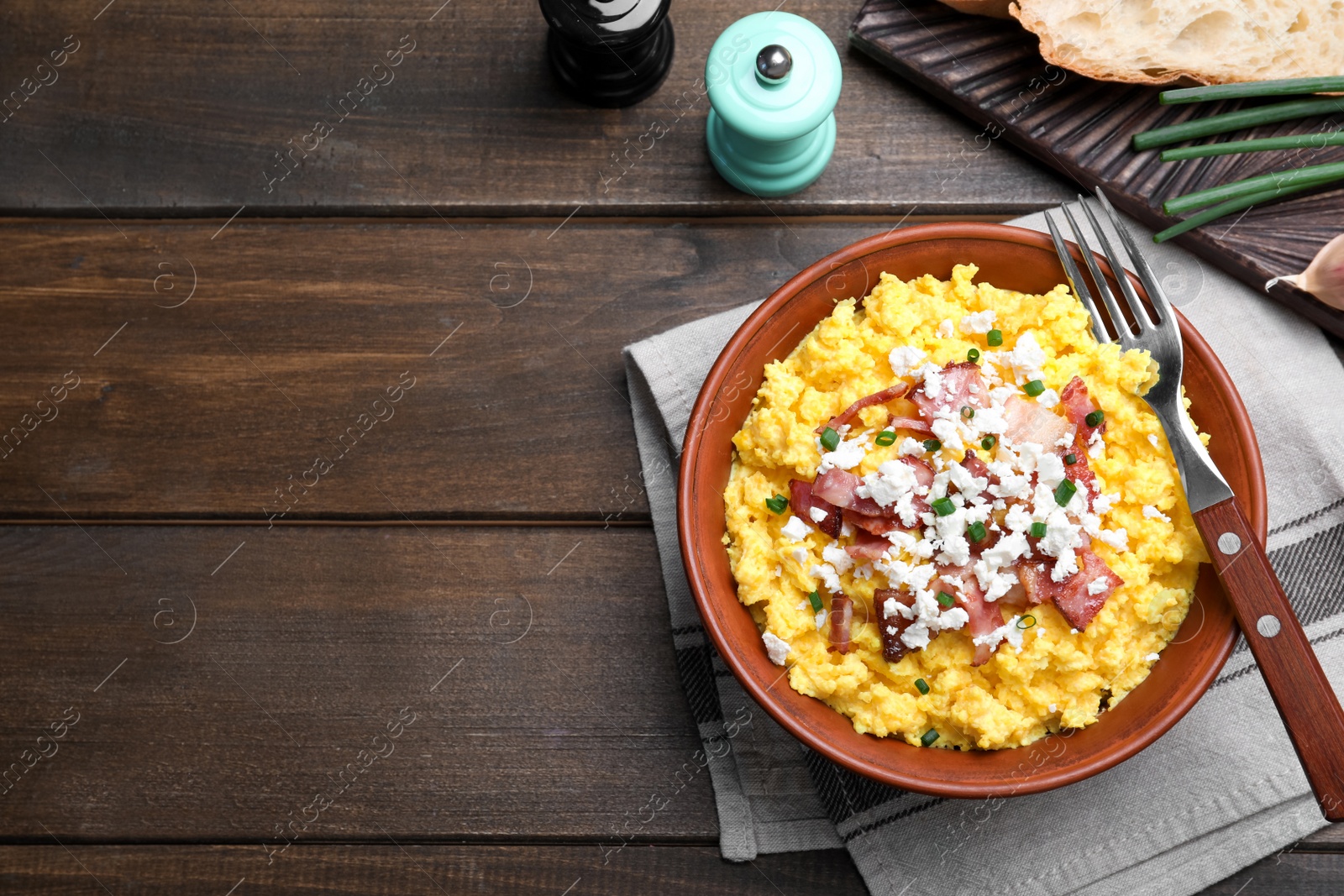 Traditional Ukrainian banosh served with brynza and pork cracklings on wooden table, flat lay. Space for text Photo of Traditional Ukrainian banosh served with brynza and pork cracklings on wooden table, flat lay. Space for text