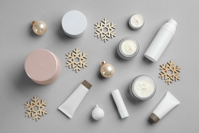 Flat lay composition with different cosmetic products on light grey background. Winter care Photo of Flat lay composition with different cosmetic products on light grey background. Winter care