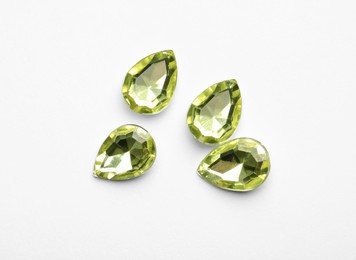 Beautiful gemstones on white background, top view Image of Beautiful gemstones on white background, top view