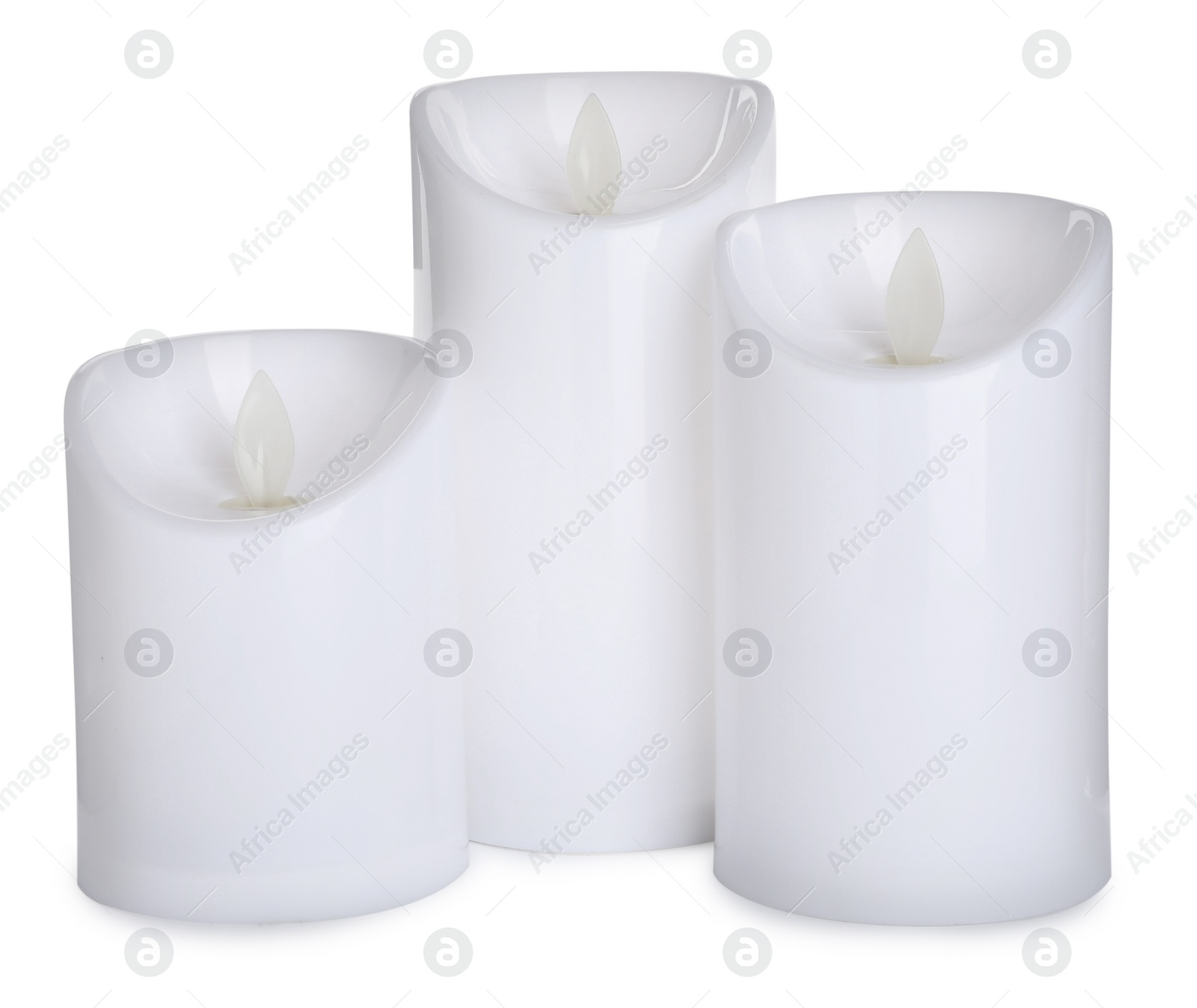 Decorative flameless LED candles on white background Photo of Decorative flameless LED candles on white background