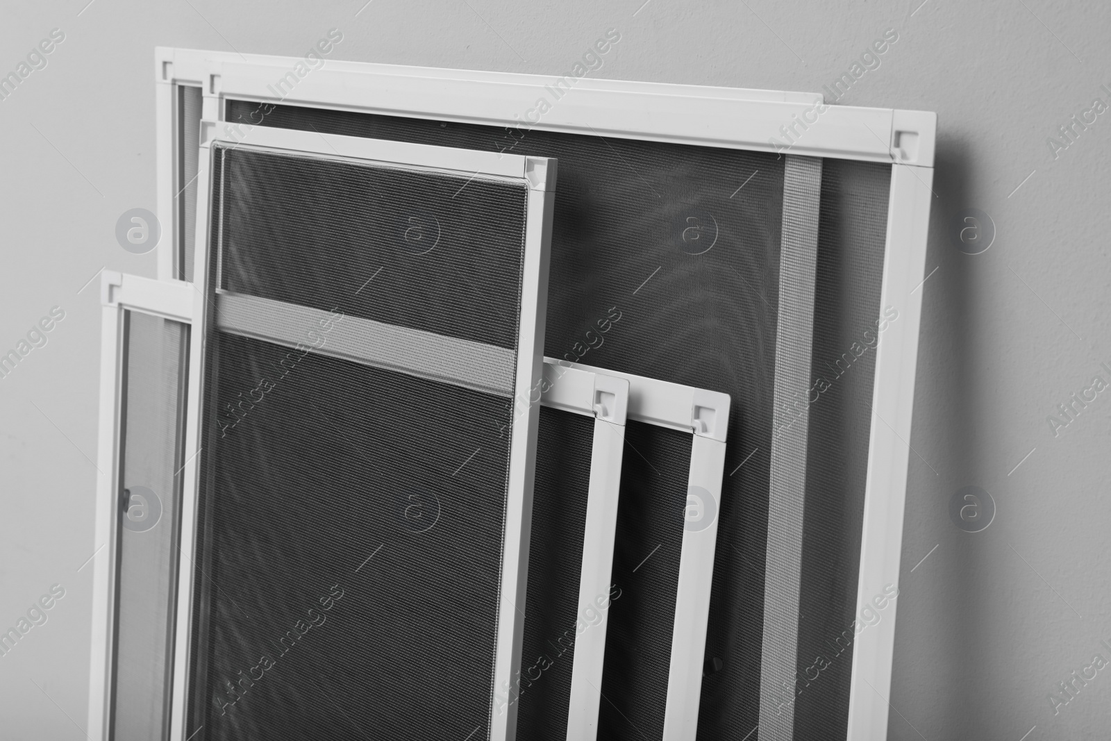 Set of window screens on light grey background Photo of Set of window screens on light grey background