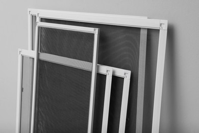 Set of window screens on light grey background Photo of Set of window screens on light grey background