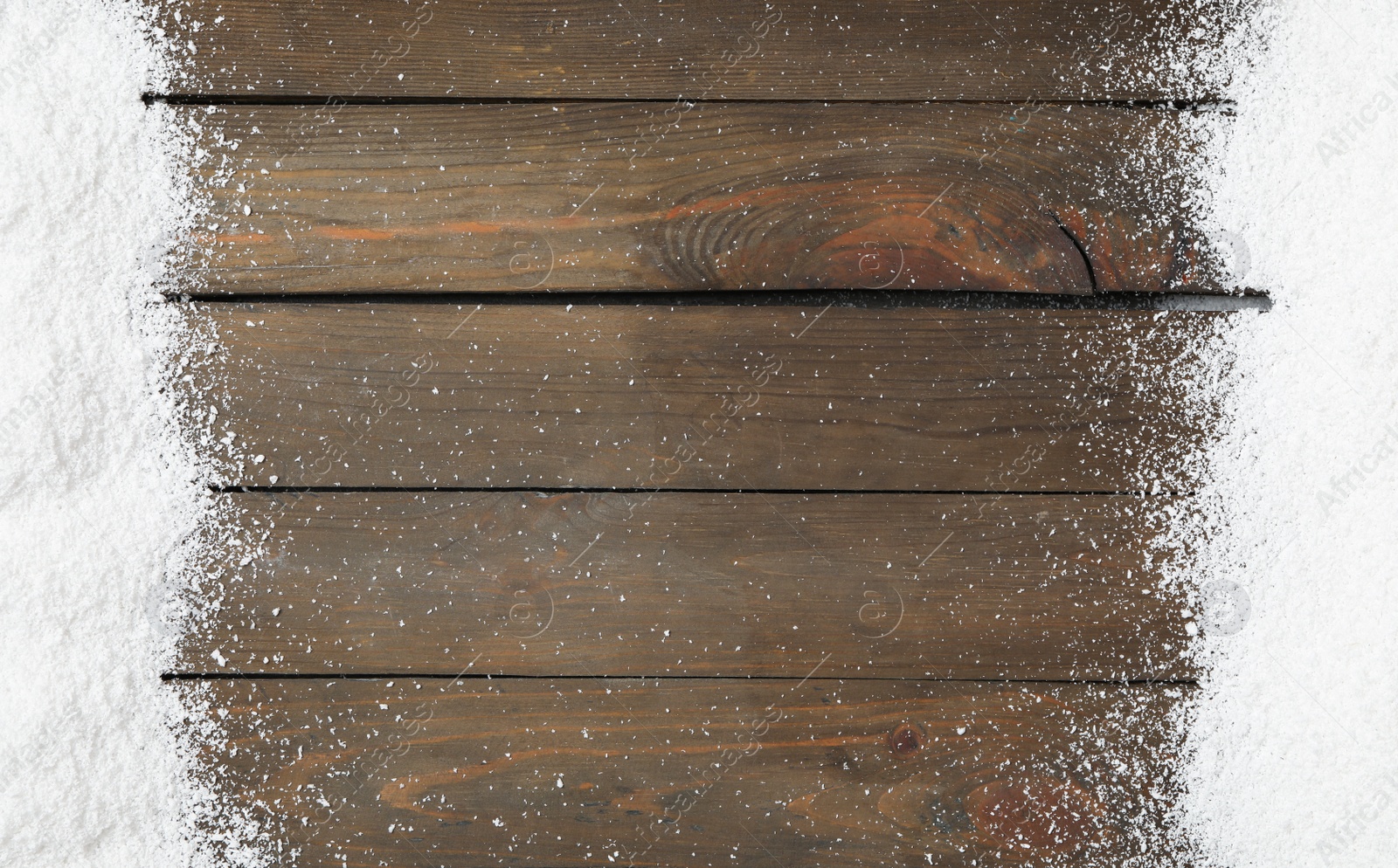 Photo of Artificial snow on wooden background, flat lay with space for text. Christmas decor