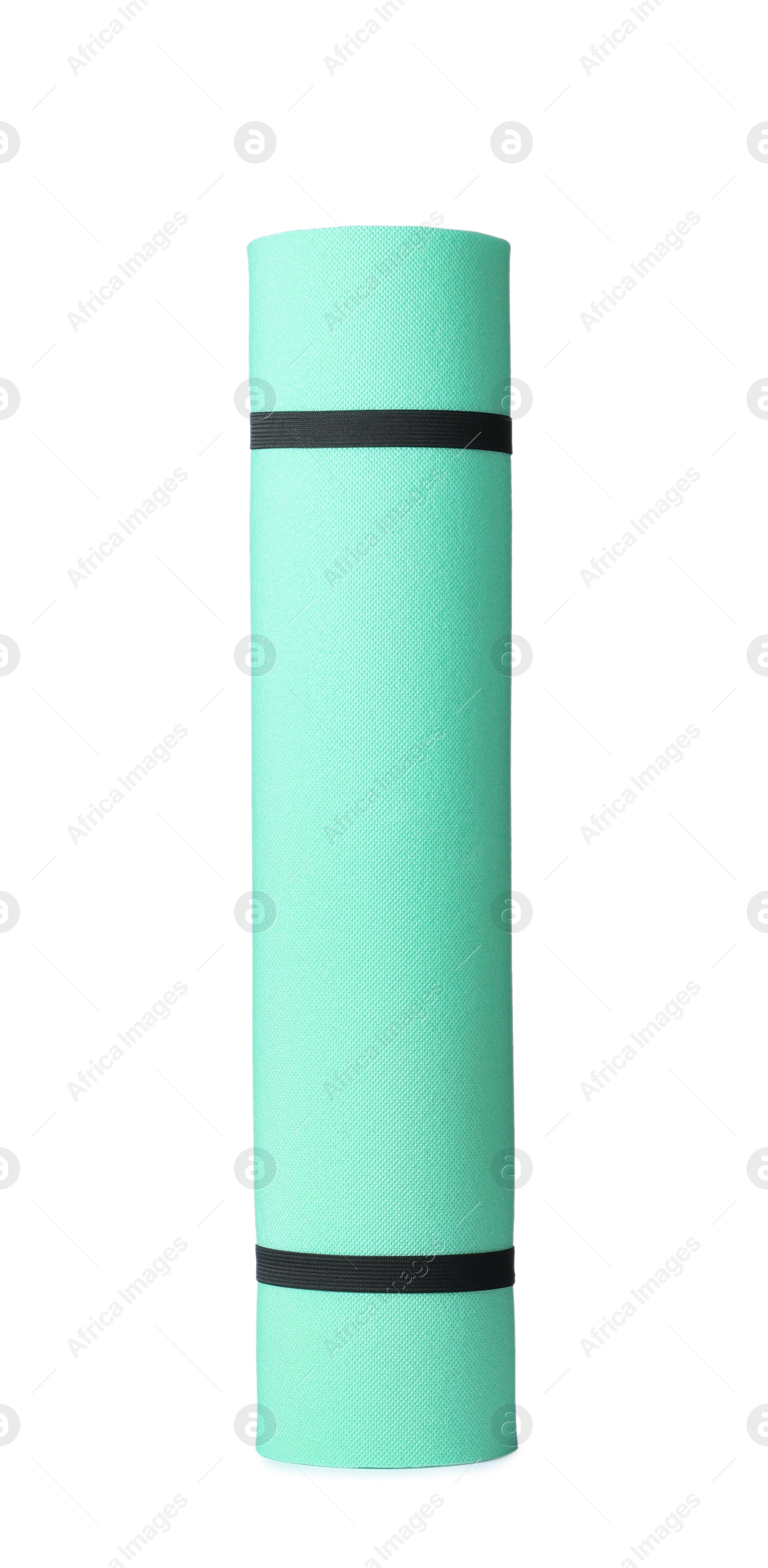 Rolled turquoise camping mat isolated on white Photo of Rolled turquoise camping mat isolated on white
