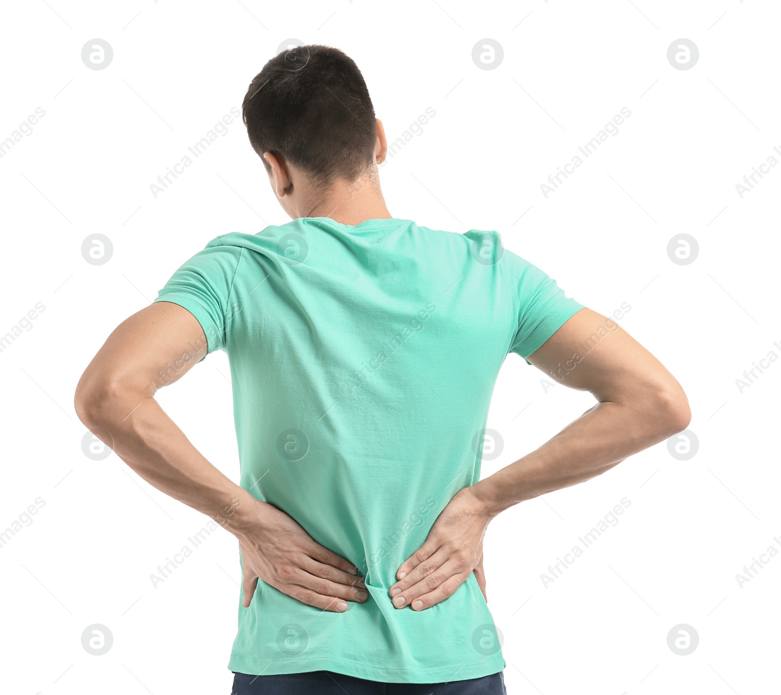 Young man suffering from back pain on white background Photo of Young man suffering from back pain on white background