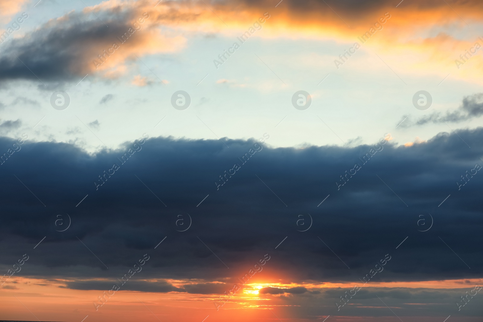 Picturesque view of beautiful sky with clouds at sunset Photo of Picturesque view of beautiful sky with clouds at sunset