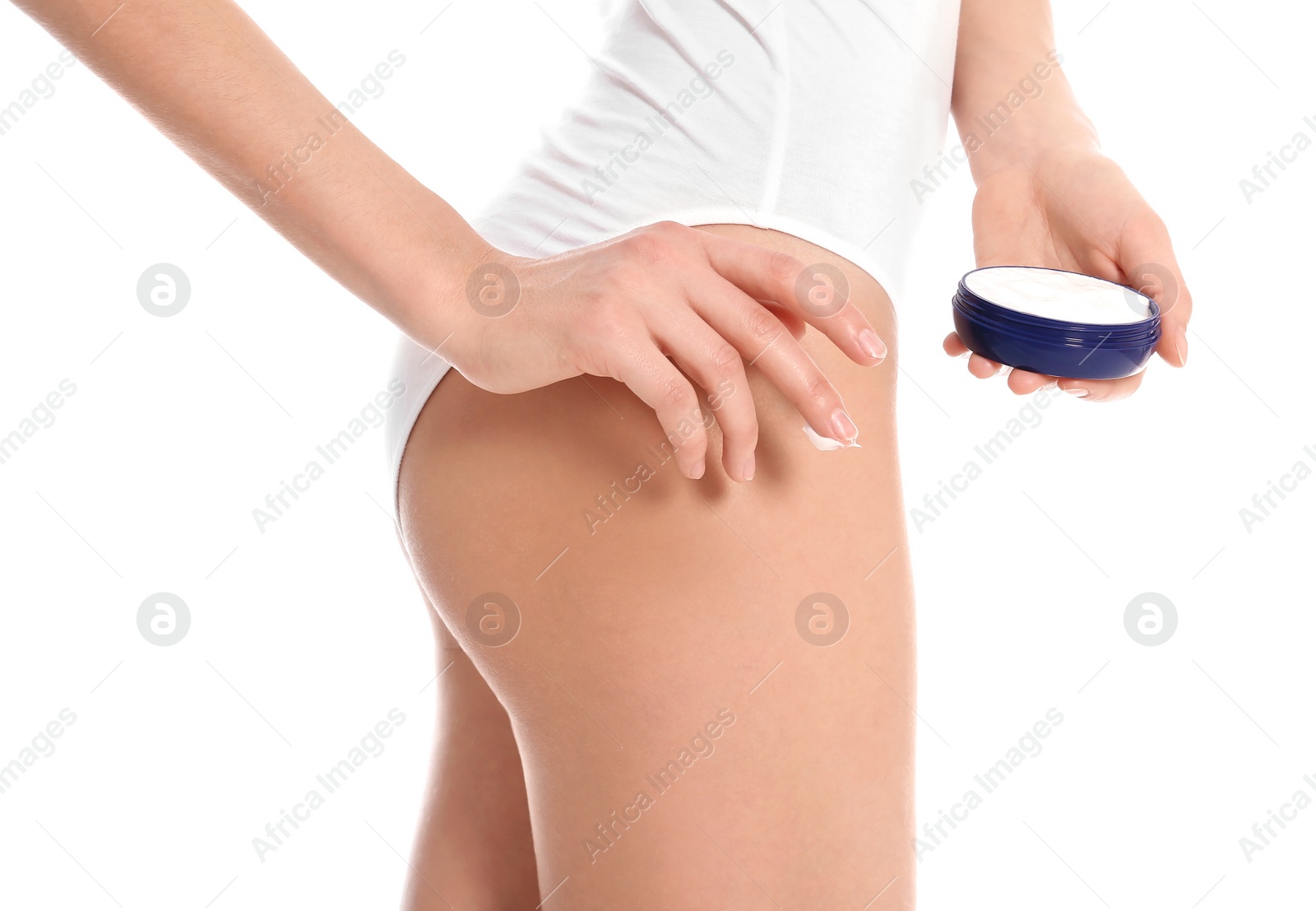 Young woman with jar of body cream on white background Photo of Young woman with jar of body cream on white background