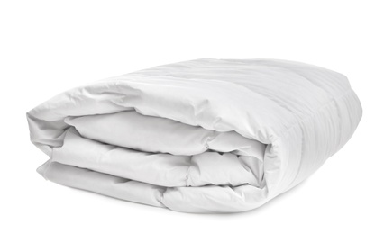 Folded soft blanket on white background. Household textile Photo of Folded soft blanket on white background. Household textile