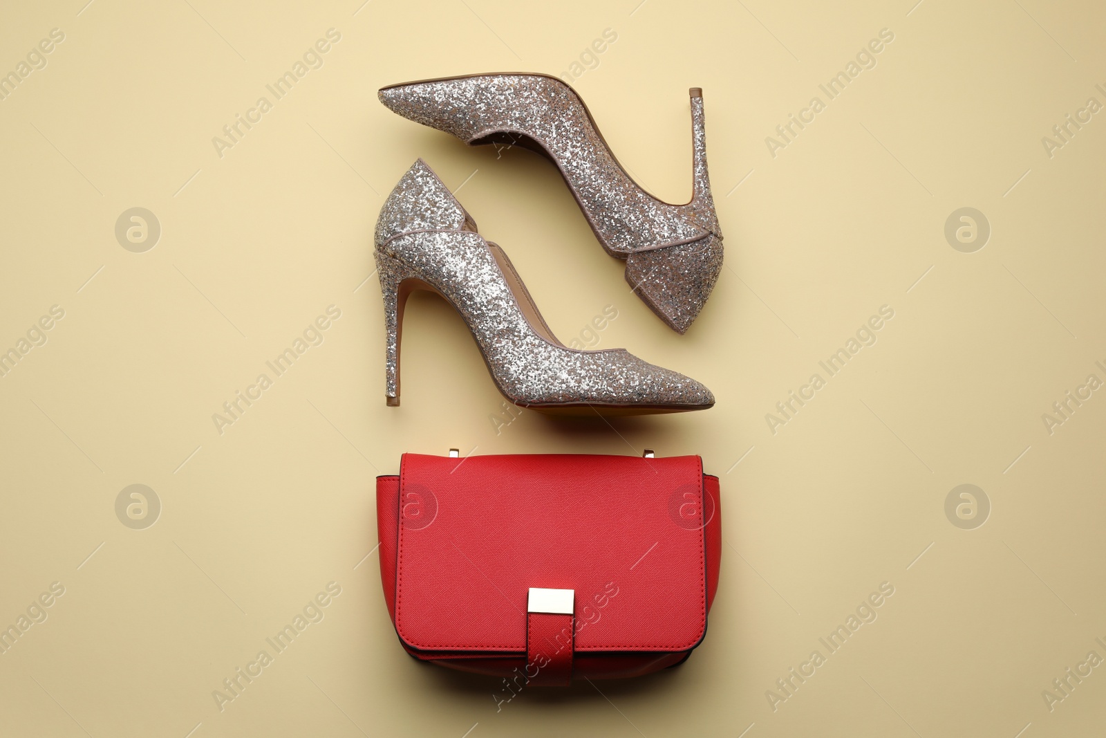 Stylish woman's bag and shoes on beige background, flat lay Photo of Stylish woman's bag and shoes on beige background, flat lay