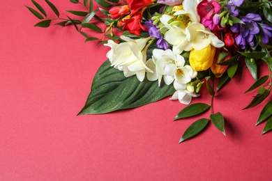 Beautiful freesia bouquet on color background Photo of Beautiful freesia bouquet on color background