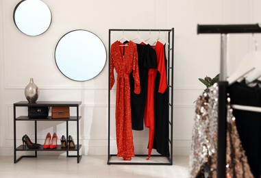 Collection of trendy women's garments in clothing rental salon Photo of Collection of trendy women's garments in clothing rental salon