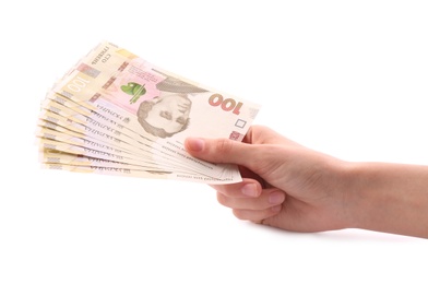 Woman holding Ukrainian money on white background, closeup Photo of Woman holding Ukrainian money on white background, closeup