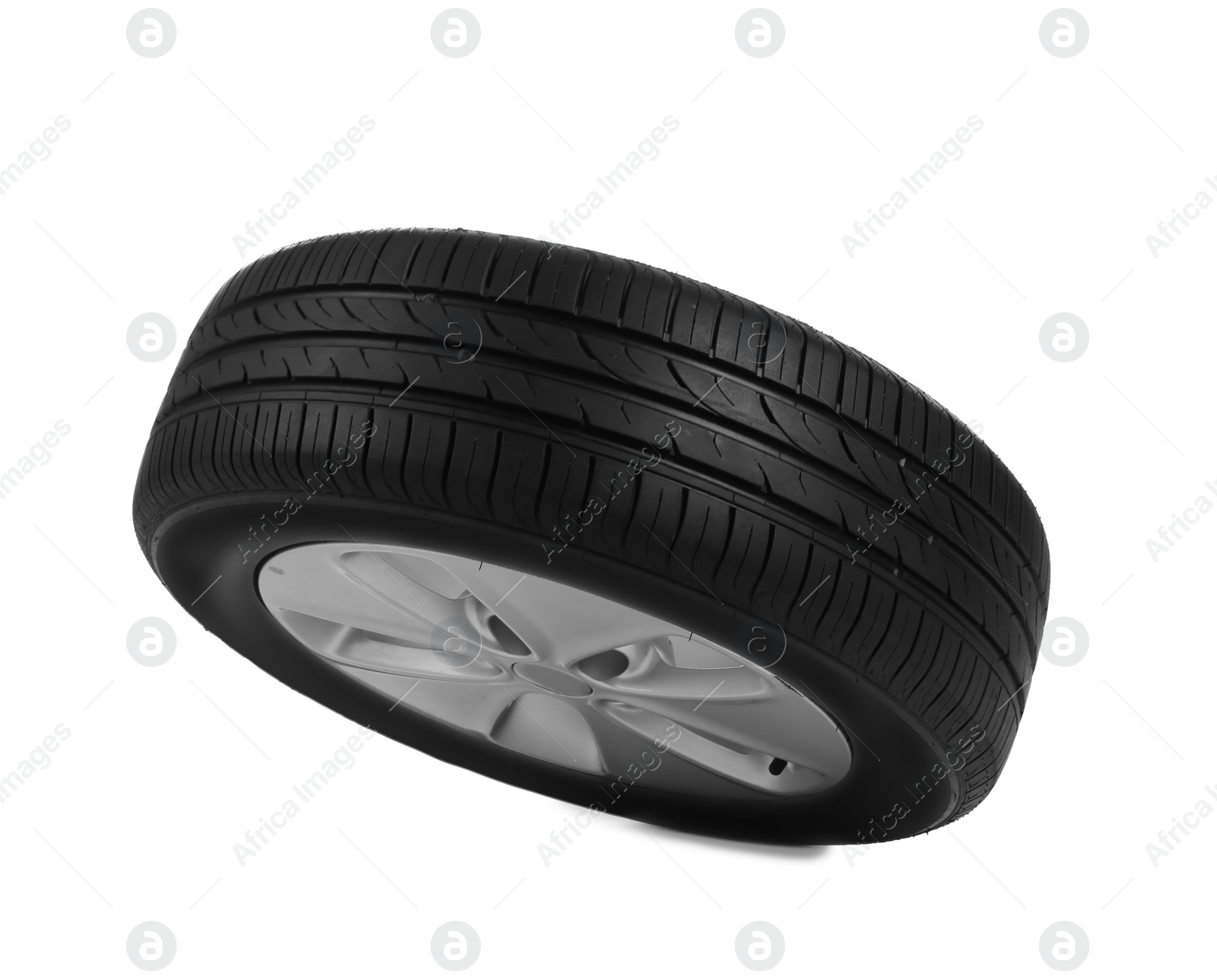 Car tire with rim on white background Photo of Car tire with rim on white background