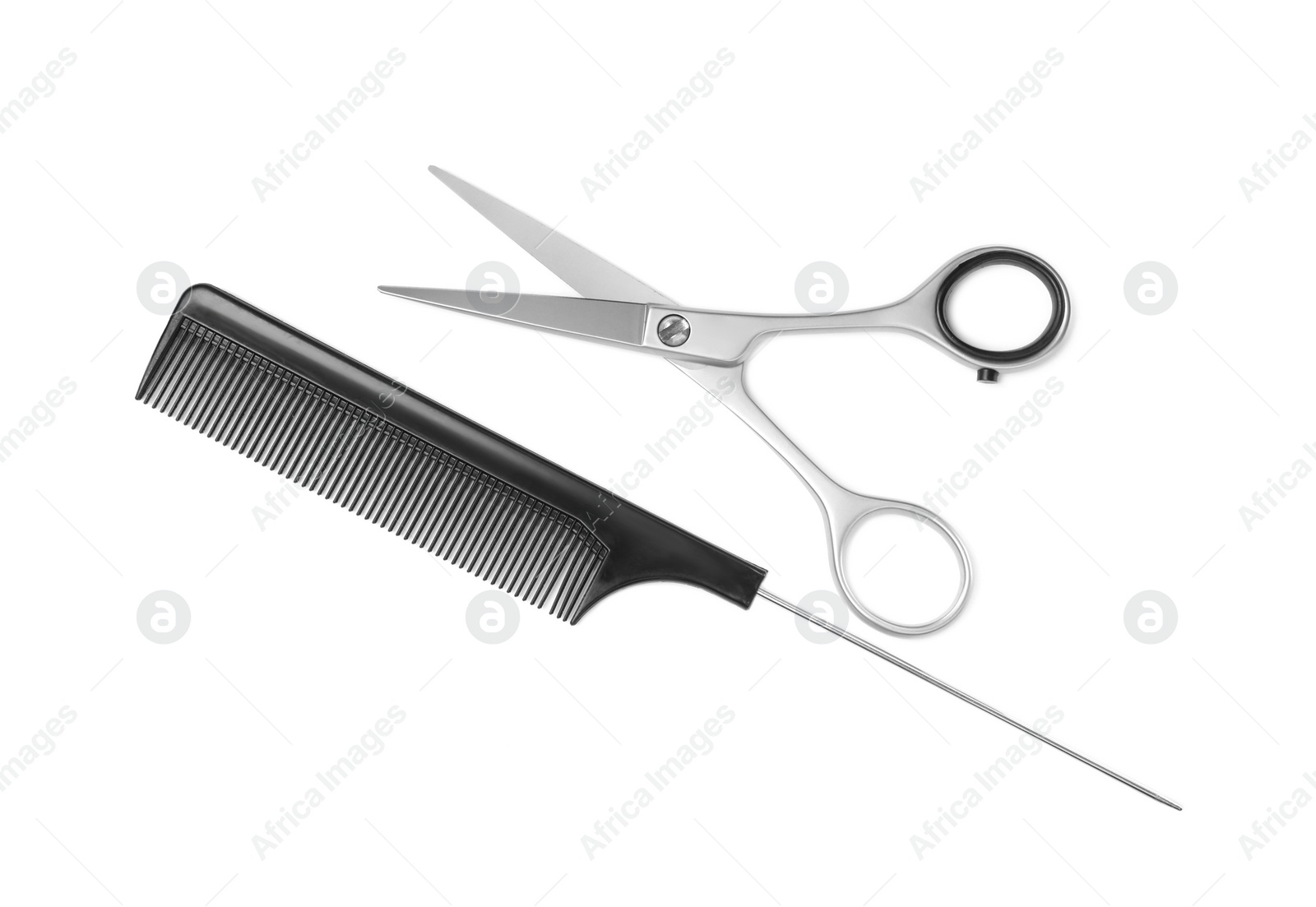New scissors and comb on white background, top view. Professional tool for haircut Photo of New scissors and comb on white background, top view. Professional tool for haircut