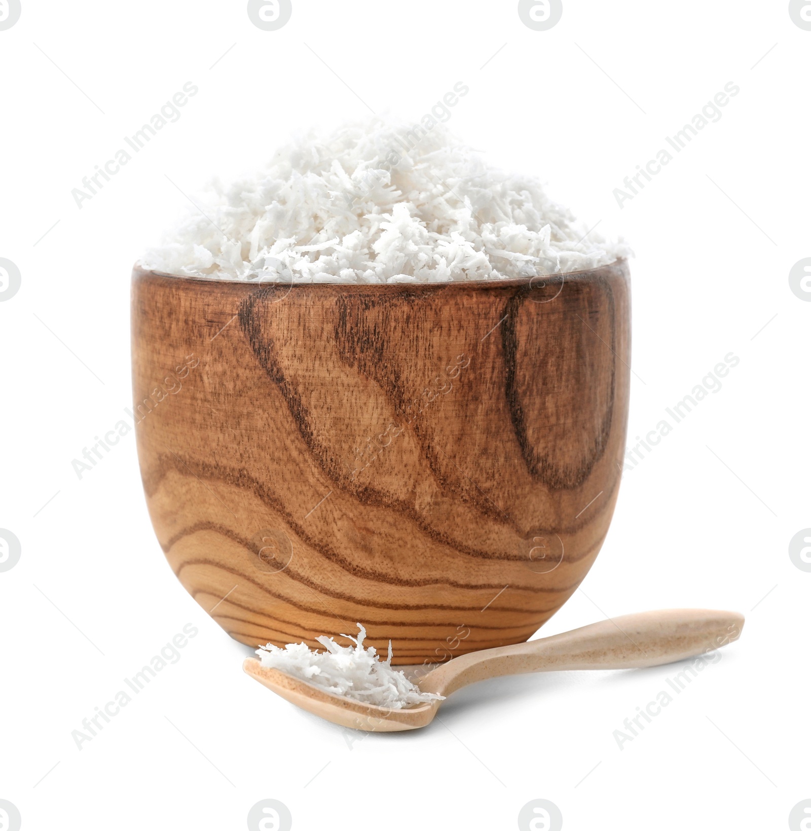 Fresh coconut flakes in bowl on white background Photo of Fresh coconut flakes in bowl on white background