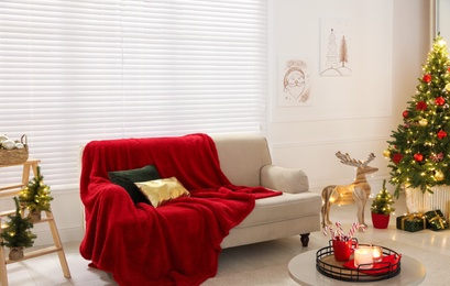 Living room with Christmas decorations. Festive interior design Photo of Living room with Christmas decorations. Festive interior design