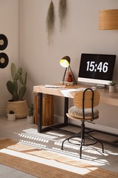 Room interior with comfortable workplace. Modern computer on wooden desk Photo of Room interior with comfortable workplace. Modern computer on wooden desk