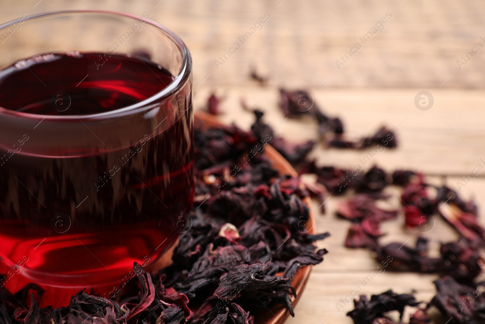 Fresh Hibiscus tea on wooden table, closeup Photo of Fresh Hibiscus tea on wooden table, closeup