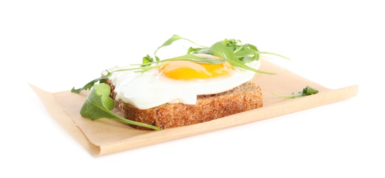 Photo of Delicious sandwich with arugula and fried egg isolated on white