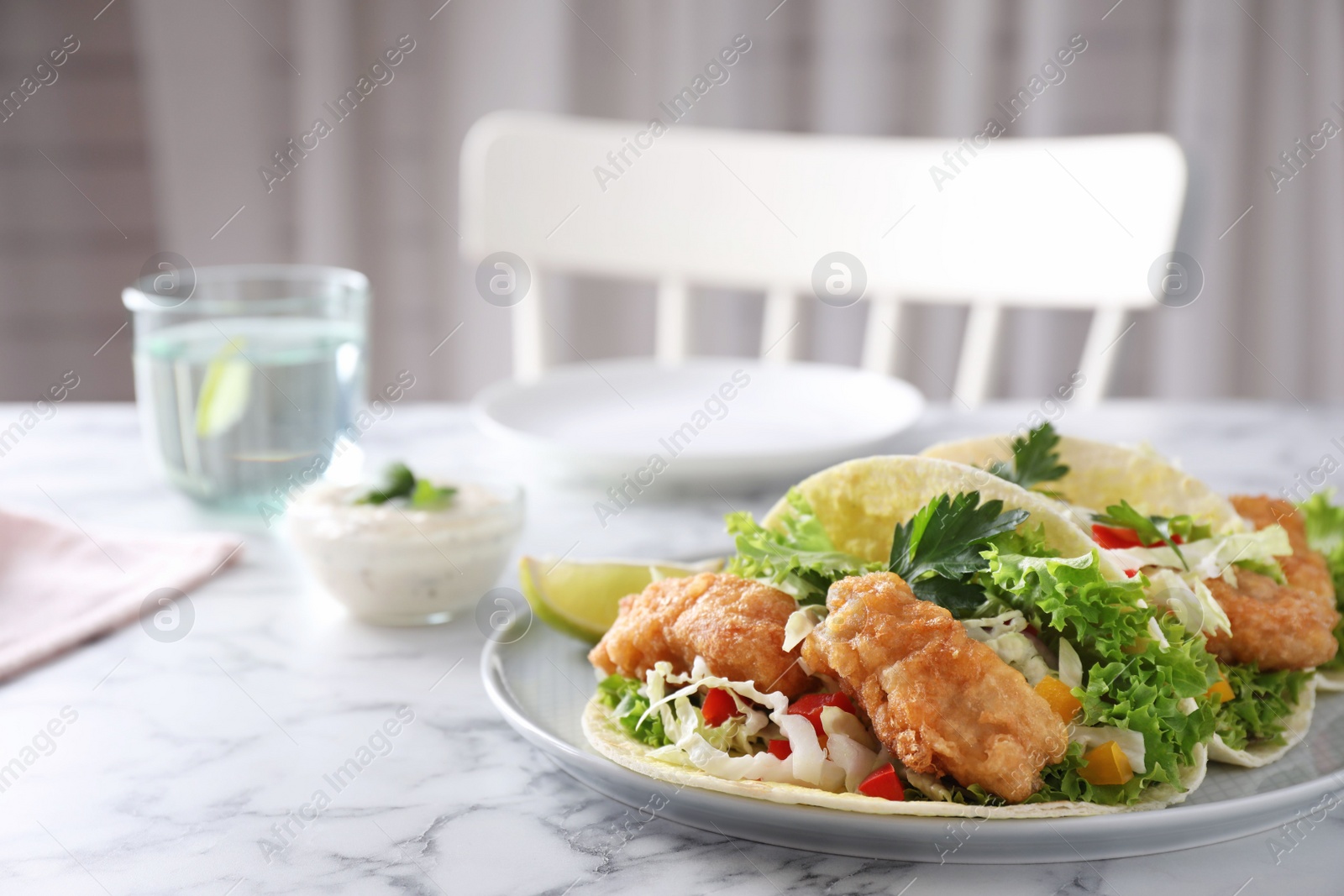 Yummy fish tacos served on white marble table, space for text Photo of Yummy fish tacos served on white marble table, space for text