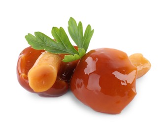 Tasty marinated honey fungus mushrooms with parsley on white background Photo of Tasty marinated honey fungus mushrooms with parsley on white background