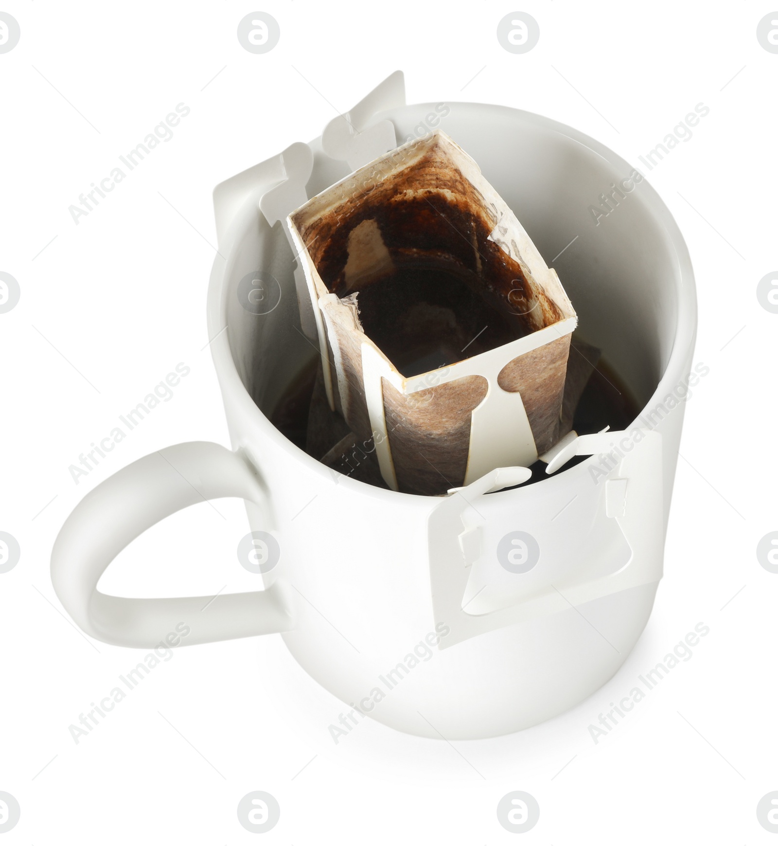Cup with drip coffee bag isolated on white Photo of Cup with drip coffee bag isolated on white