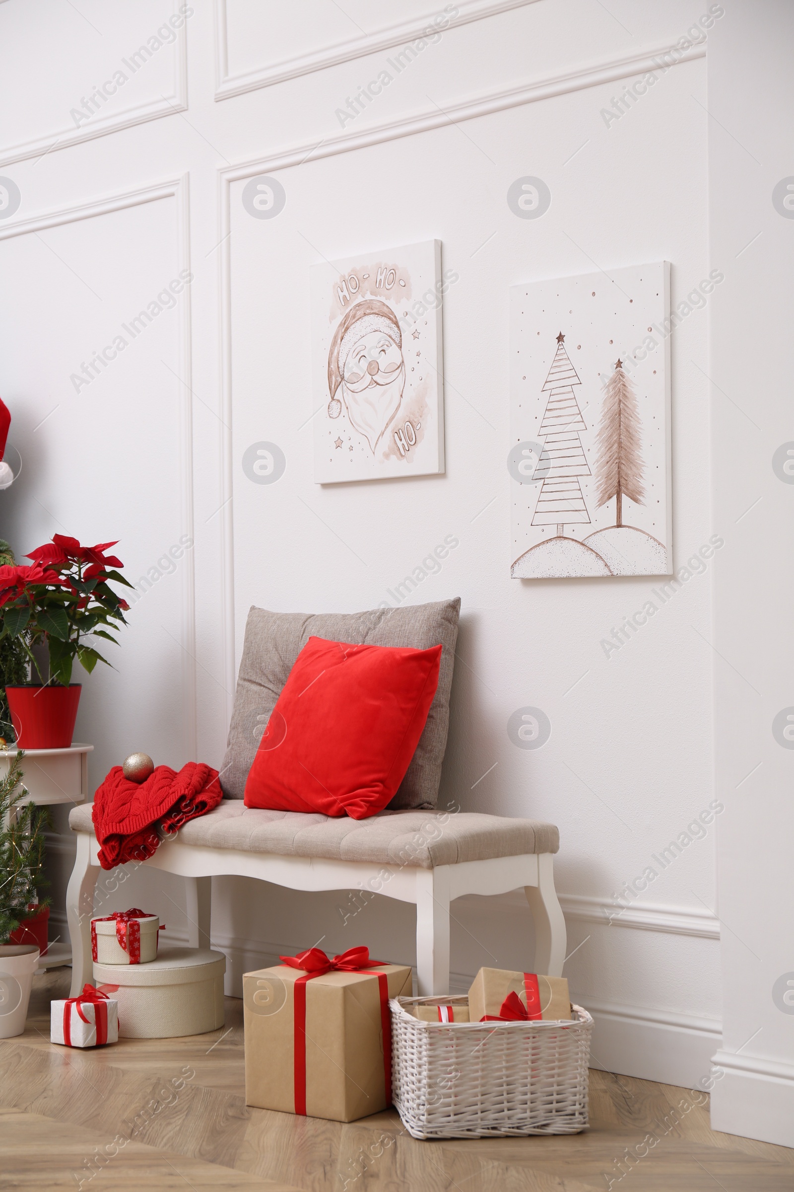 Christmas themed pictures in bright room with festive decorations. Interior design Photo of Christmas themed pictures in bright room with festive decorations. Interior design