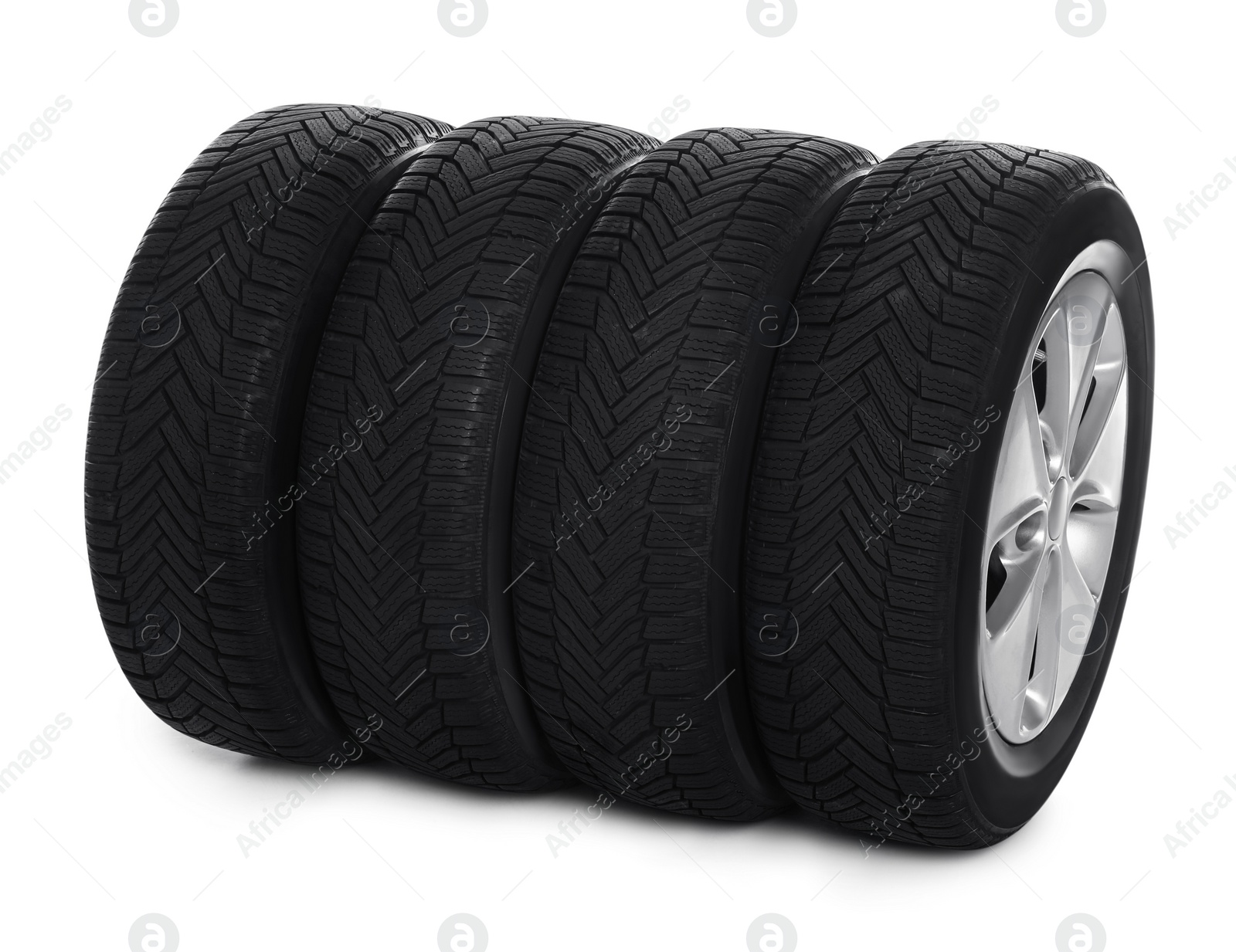 Set of wheels with winter tires on white background Photo of Set of wheels with winter tires on white background